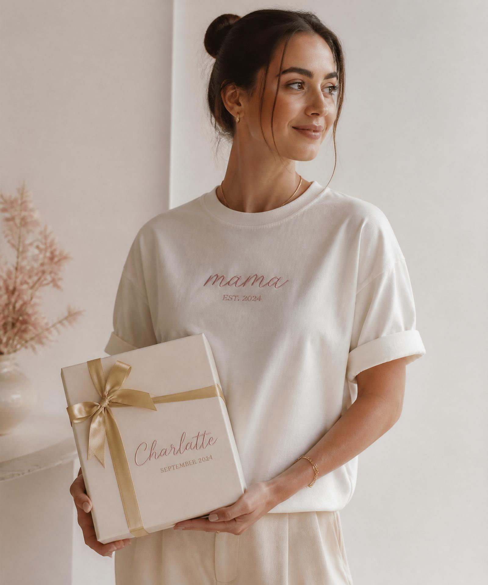Woman in a personalized custom shirt holding a bespoke gift box